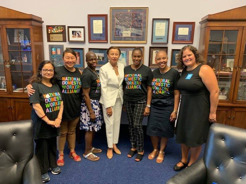 Image of people standing in office with elected official wearing NDWA t-shirts