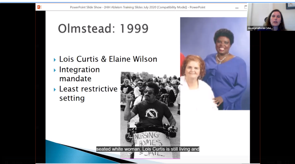 Slide Image Black woman touching white woman on the shoulder and man with mustache and sunglasses in wheelchair sign reads Nursing Homes = Jails