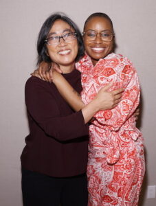 Stacy Kono and Jenn Stowe embracing and smiling