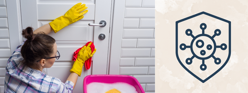 A white lady wiping a white door, on the left there is a germ graphic. 